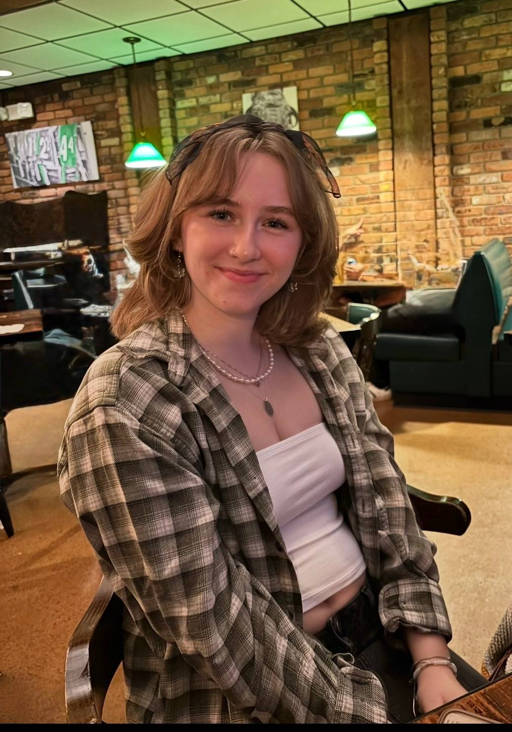 Bria Loveday smiling in a restaurant.
